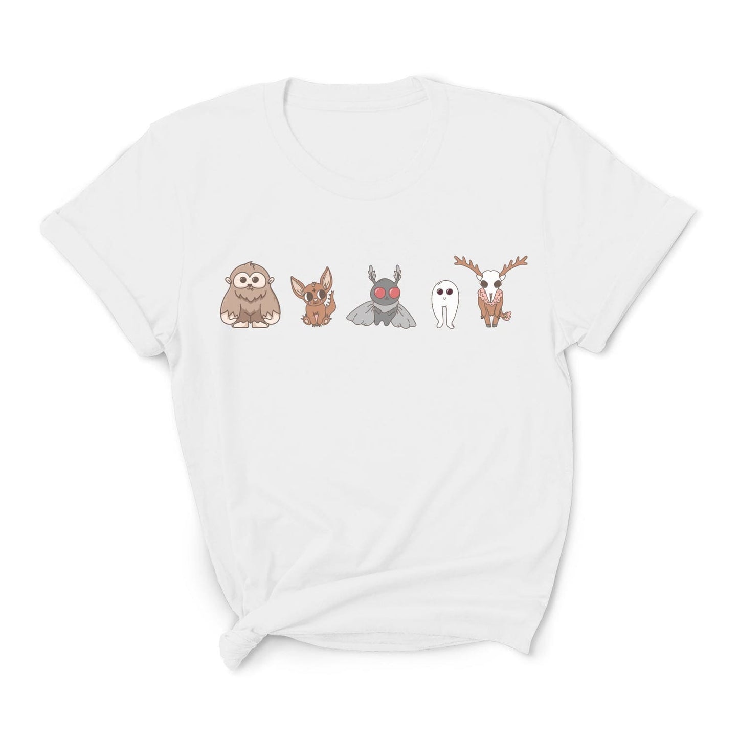 White t-shirt with cartoon character designs on a white background: Cute Cryptids Comfort Colors Shirt, Kawaii Bigfoot Chupacabra Mothman Fresno Wendigo Tee, Funny Cryptidcore Gift, Folklore Mythology T-Shirt