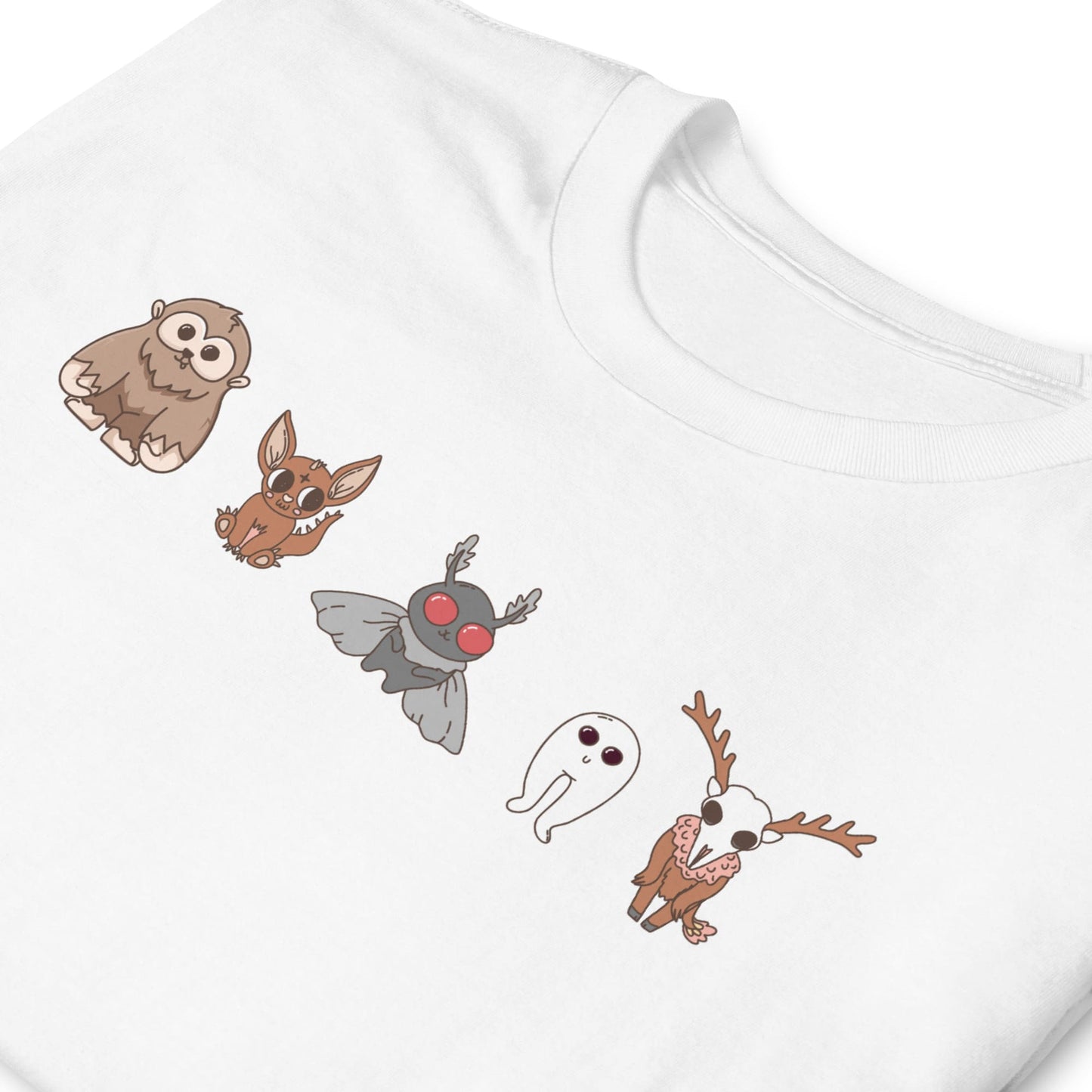 White t-shirt with cartoon animal designs on a white background: Cute Cryptids Comfort Colors Shirt, Kawaii Bigfoot Chupacabra Mothman Fresno Wendigo Tee, Funny Cryptidcore Gift, Folklore Mythology T-Shirt