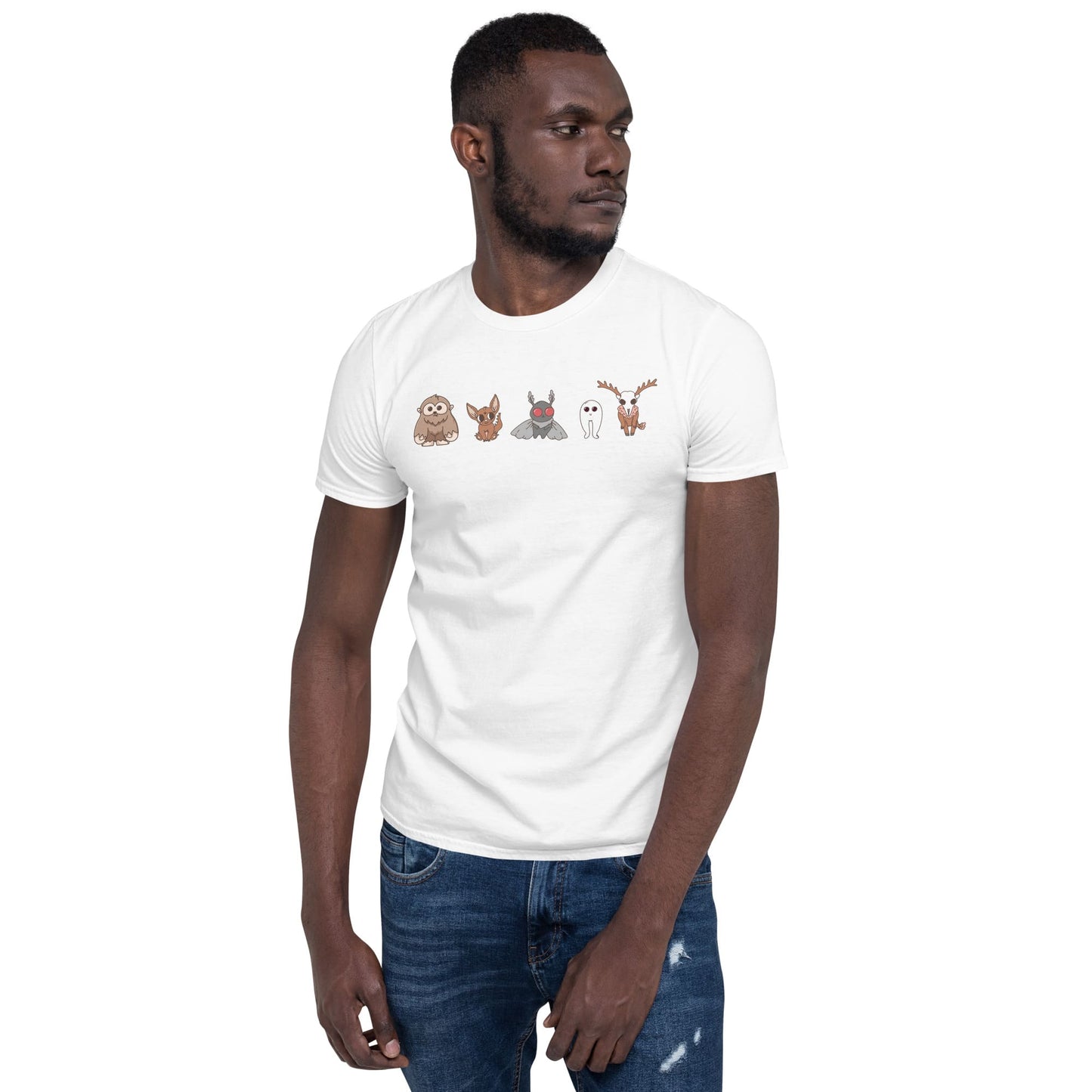 Man wearing a white t-shirt with cartoon animal designs on a white background: Cute Cryptids Comfort Colors Shirt, Kawaii Bigfoot Chupacabra Mothman Fresno Wendigo Tee, Funny Cryptidcore Gift, Folklore Mythology T-Shirt