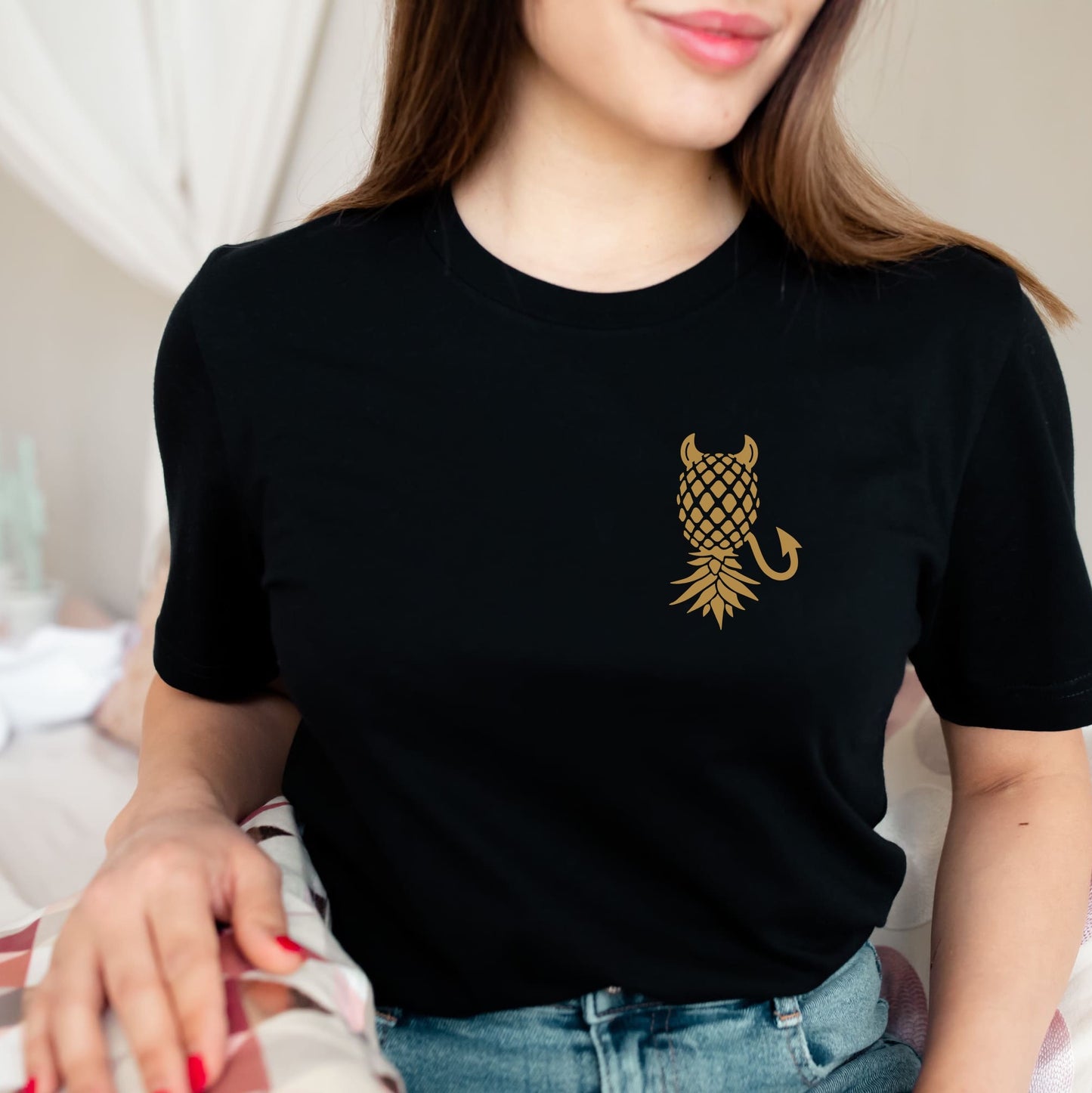 Person wearing a black t-shirt with a gold pineapple design: Subtle Swingers Lifestyle Shirt, Devilish Upside Down Pineapple Tee, Funny Gift For Swinging Non Monogamy Couples, Adult Humor T-Shirt