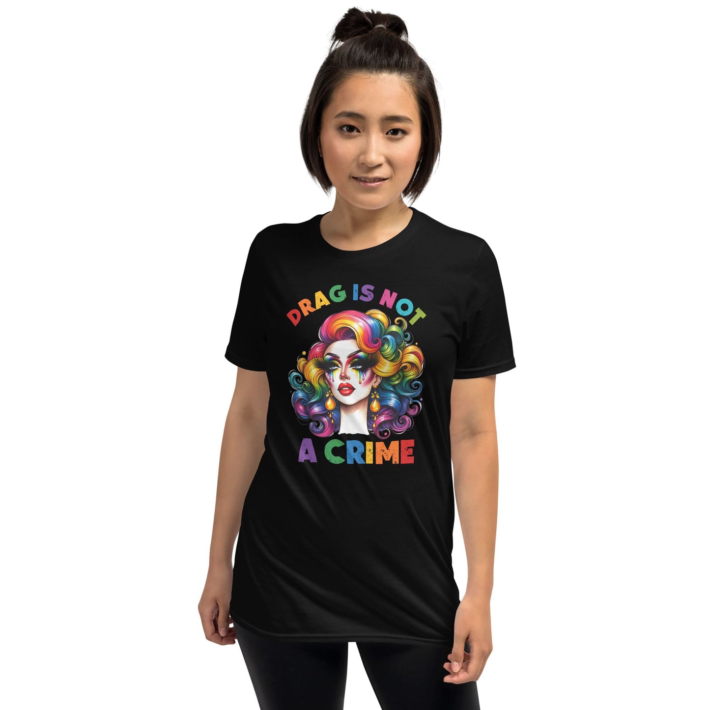 Person wearing a black t-shirt with a colorful graphic and text on a white background: Drag Is Not a Crime Shirt, Drag Queen Pride Tee, Protect Drag Tshirt, Pro Drag Statement Top LGBTQ Gay Pride Month Inclusivity Equality Gift