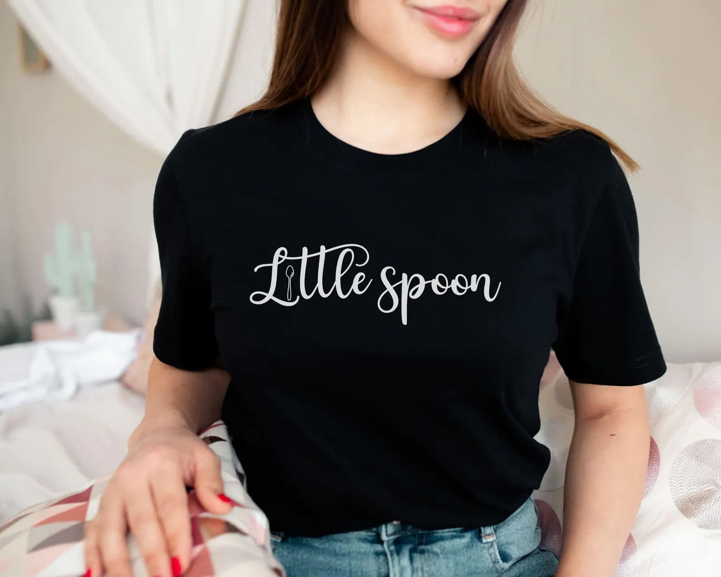 Polyamory person wearing a black ENM t-shirt with 'Little spoon' text
