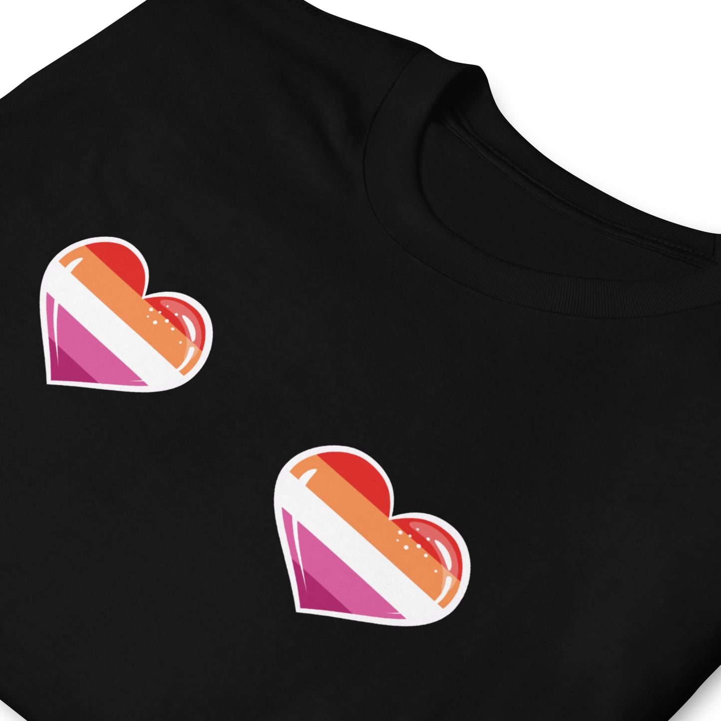 Black t-shirt with lesbian flag heart-shaped designs on a white background