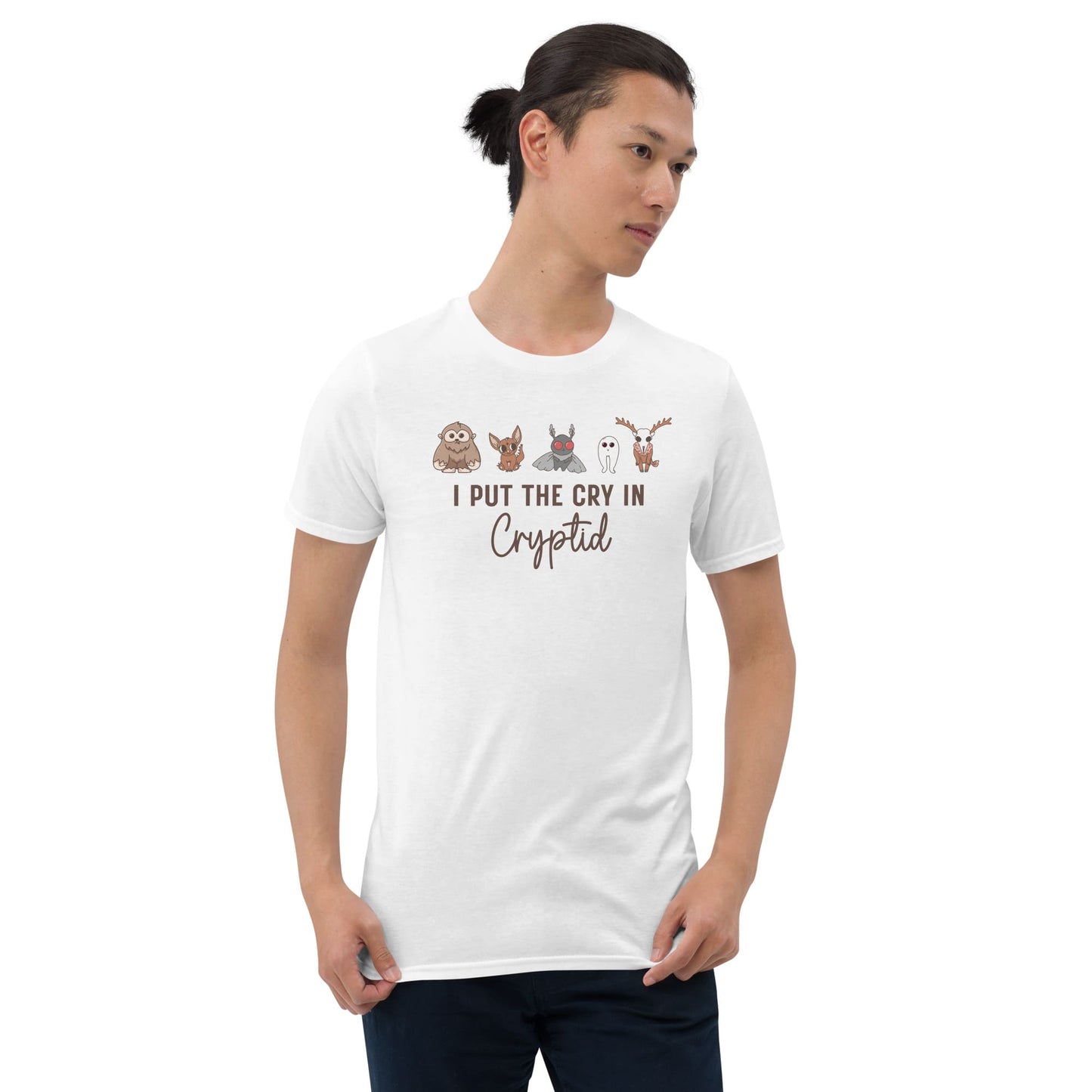 Person wearing a white t-shirt with cartoon characters and text on a white background: Funny Cryptid Mental Health Awareness Comfort Colors Shirt, Cute Cryptidcore Neurodivergent Tee, Kawaii Cryptozoology Neurospicy T-Shirt