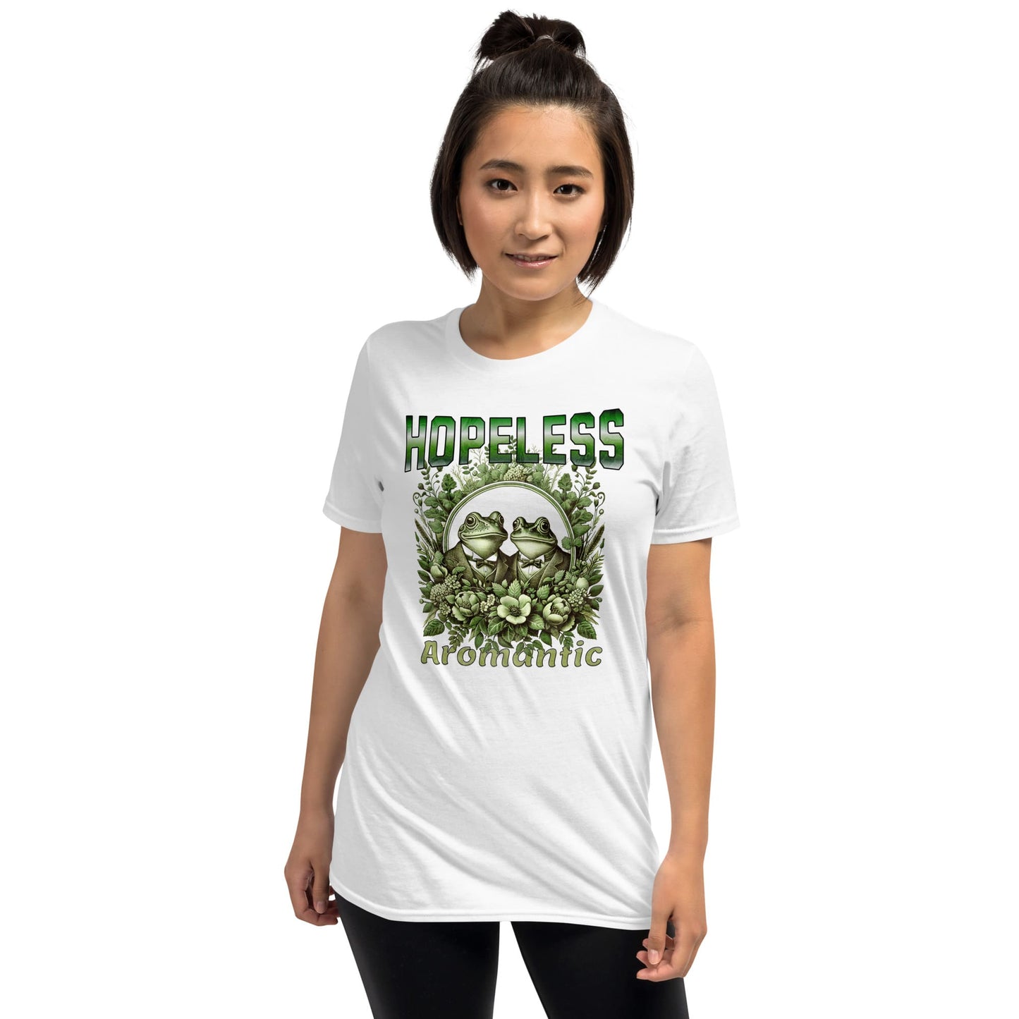 Person wearing a white aromantic t-shirt with frogs graphic and text on a white background