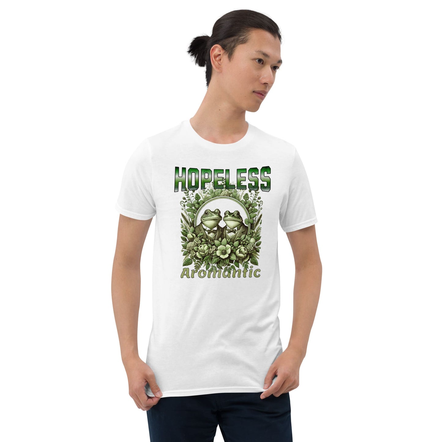 Person wearing a aro pride white t-shirt with green frogs and text on a white background