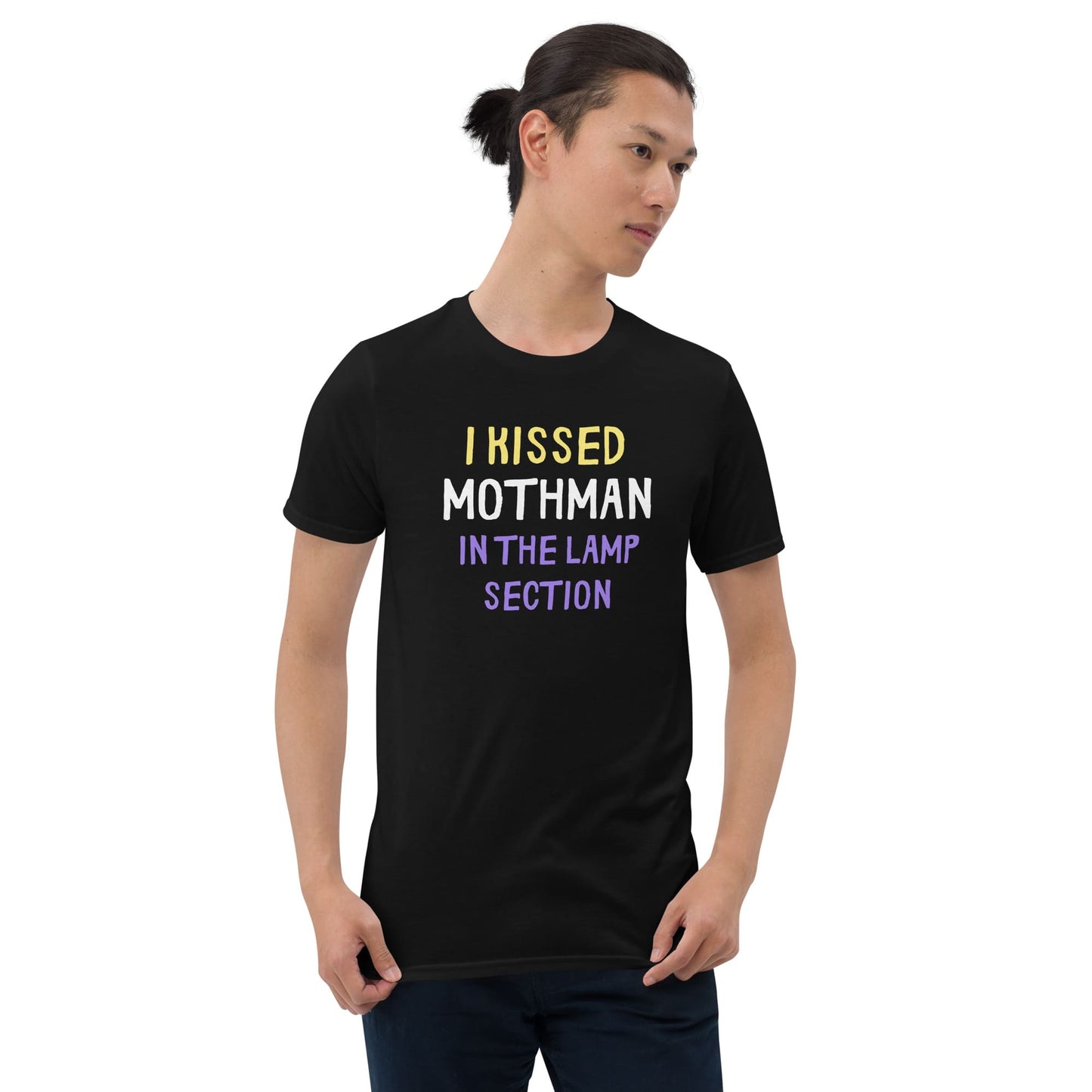 Person wearing a black t-shirt with text on a white background: Nonbinary Humor Shirt, Funny Mothman Cryptid Tee, Spooky Queer Pride Gift, LGBTQ Meme T-Shirt ,Enby Weirdcore Top, Cryptidcore Mythology