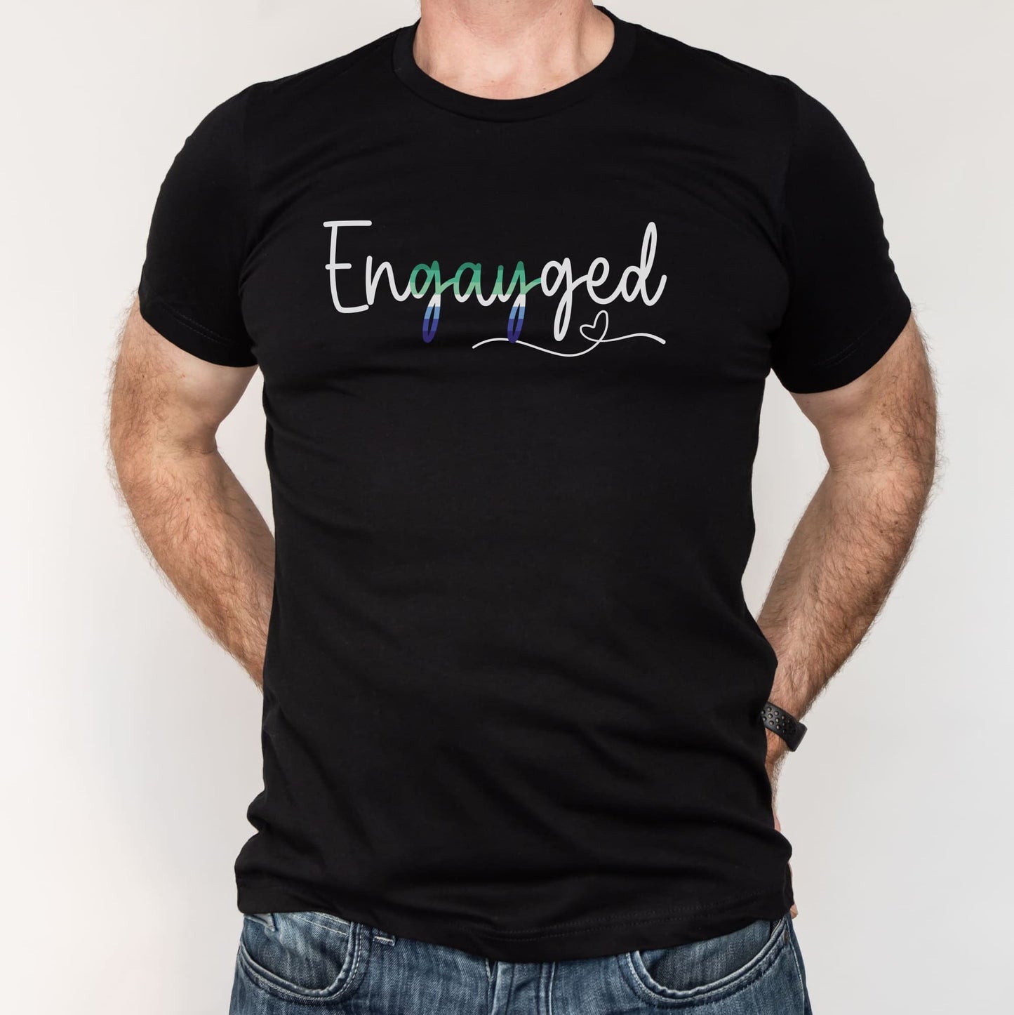 Black t-shirt with gay MLM engagement 'Engayged' text on a plain background