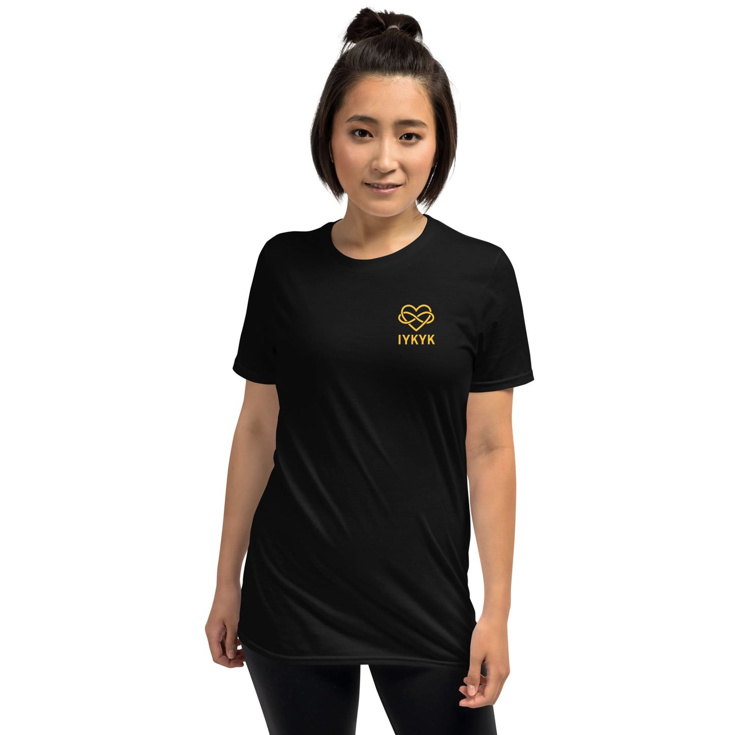 Person wearing a black ENM t-shirt with a yellow logo and text on a white background: Subtle Polyamory Shirt, Funny Open Relationship Tee, Polyamorous Pride T-Shirt, Non Monogamy, Polycule Gift For Big Middle Little Spoon