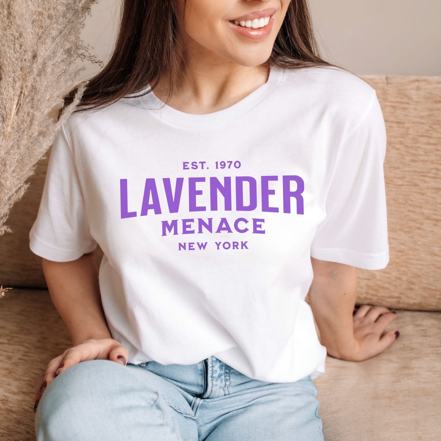 Woman wearing a white t-shirt with 'Lavender Menace New York' text in purple: Lavender Menace Shirt, Lesbian Pride Tee, Queer Resistance T-Shirt, Sapphic Feminist Gift, LGBTQ Activist, Subtle WLW Pride 70s Feminism