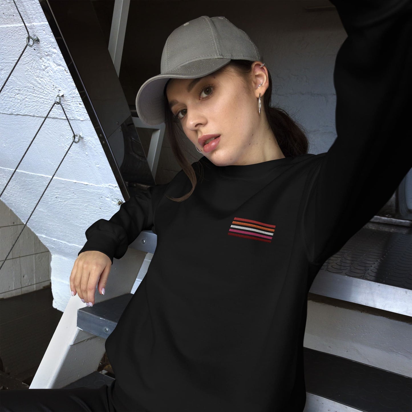 lesbian sweatshirt, subtle sunset flag embroidered pocket design sweater, model 2