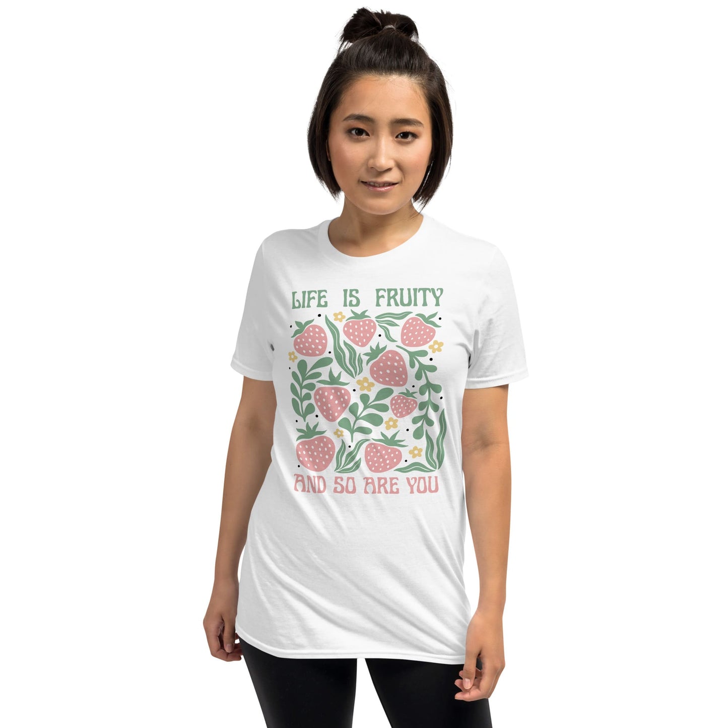 Woman wearing a white t-shirt with a fruit-themed design and text: Funny Fruity Shirt, Subtle Queer Tee, Summer Strawberry T-Shirt, Pastelcore LGBTQ Outfit, Botanical Gay Lesbian Trans Bi Pan Ace Enby Gift