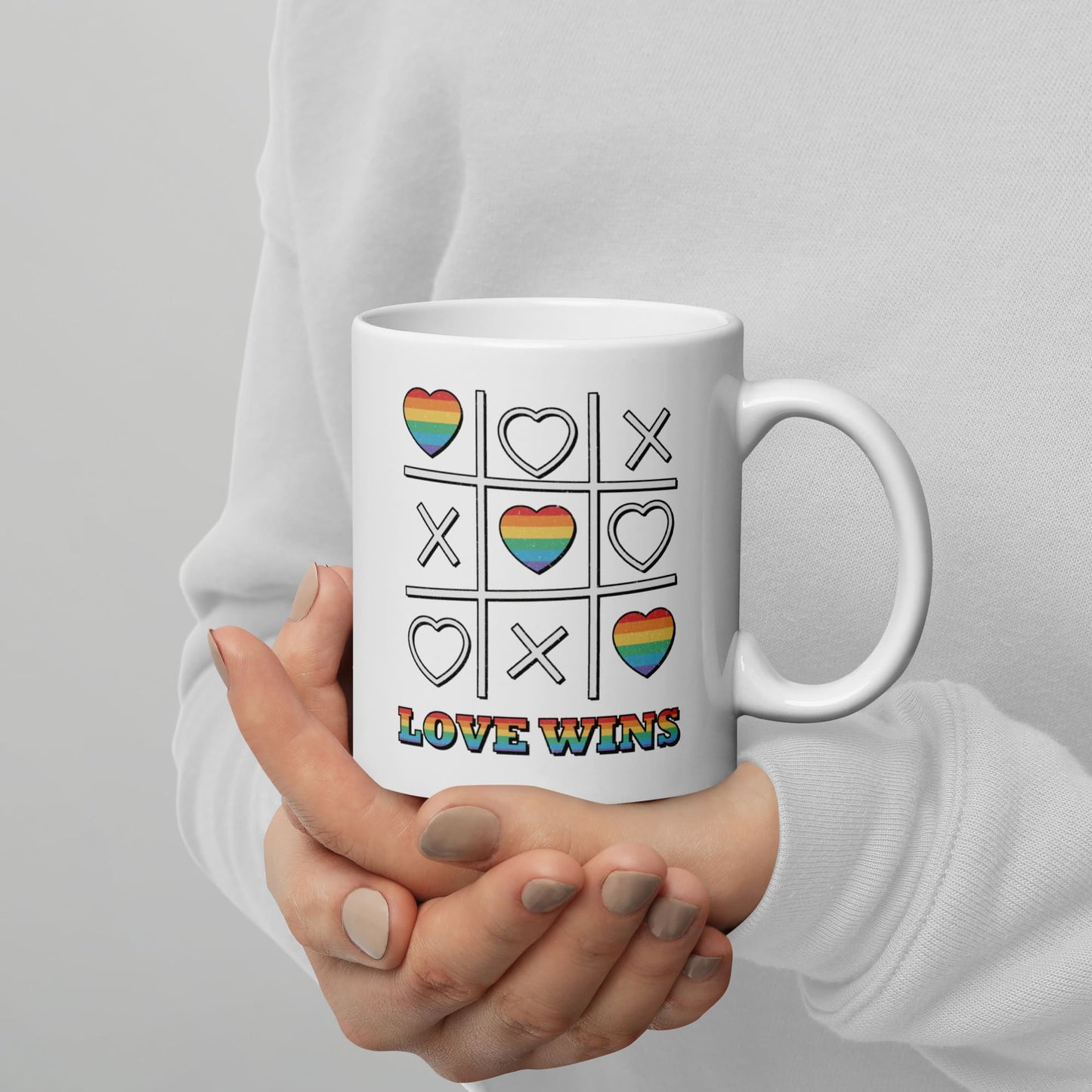 LGBT mug, love wins pride coffee or tea cup on hands
