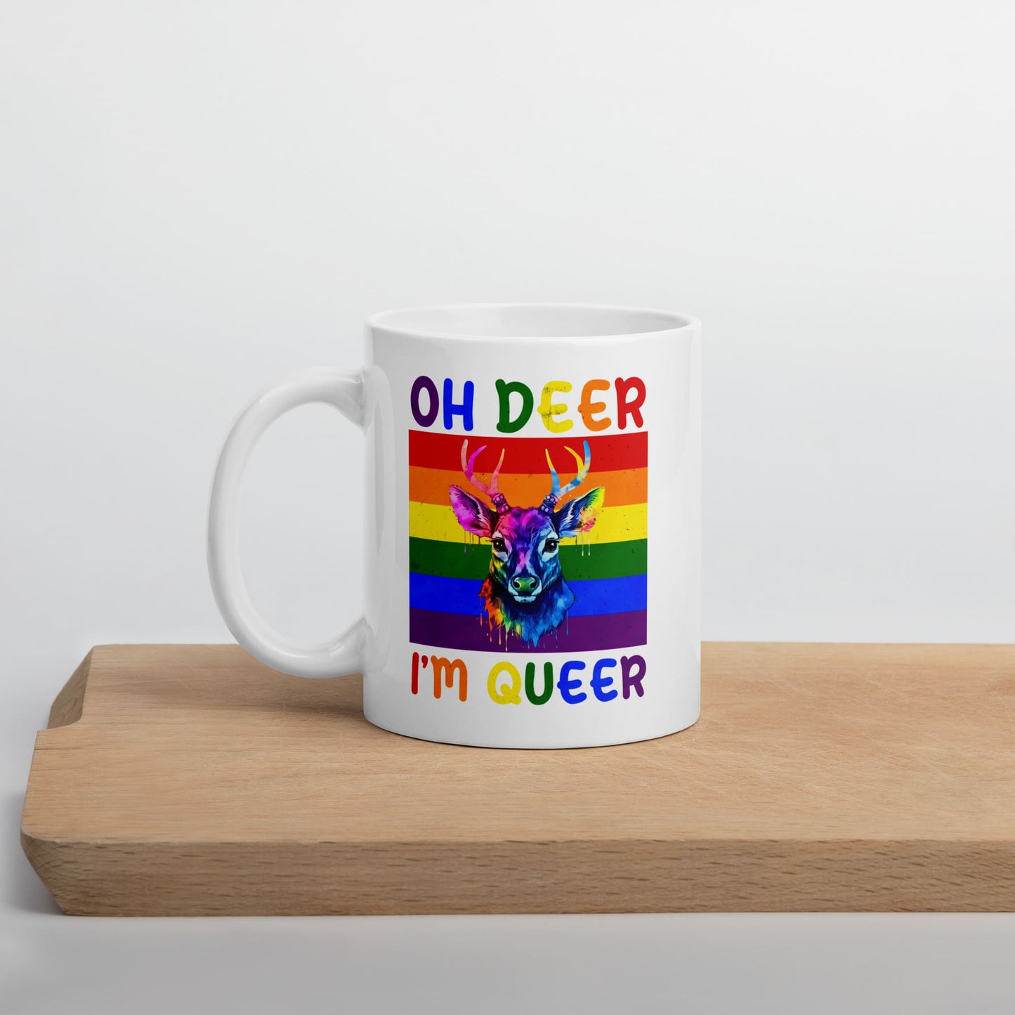 queer mug, funny rainbow deer coffee or tea cup on table