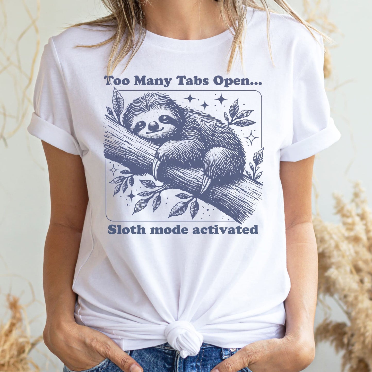 Person wearing a white t-shirt with a sloth graphic and text, standing against a neutral background: Overstimulated Sloth Shirt, Too Many Tabs Open, Mental Health Awereness TShirt, Social Anxiety Sarcastic Neurospicy Gift, Neurodivergent Tee