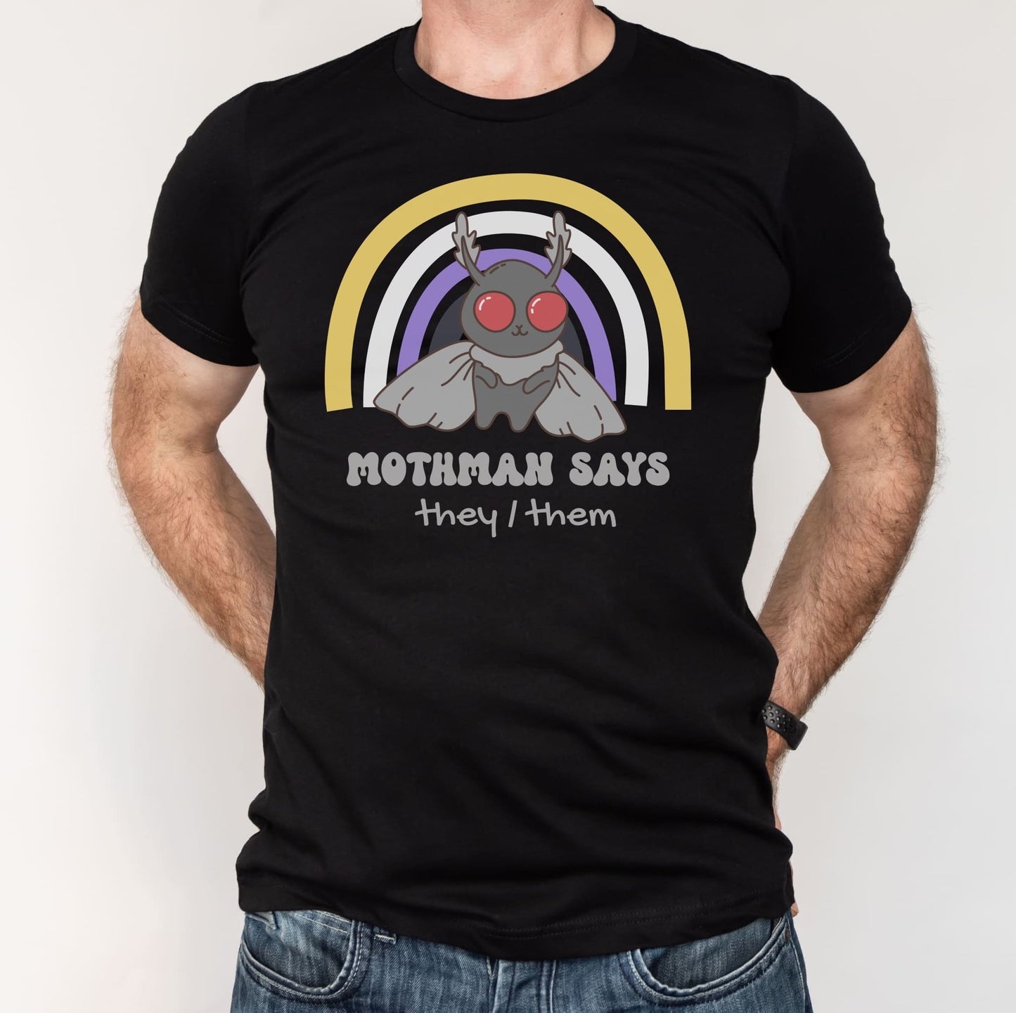 Black t-shirt with Mothman graphic and text on a white background: Personalized Nonbinary Mothman Shirt, Custom Pronouns Enby Pride Cryptid Tee, Folklore Mythology They Them T-Shirt, Queer Cryptozoology Gift