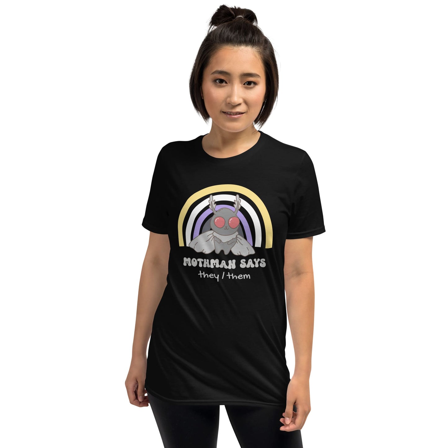 Person wearing a black t-shirt with a graphic design and text on a white background: Personalized Nonbinary Mothman Shirt, Custom Pronouns Enby Pride Cryptid Tee, Folklore Mythology They Them T-Shirt, Queer Cryptozoology Gift