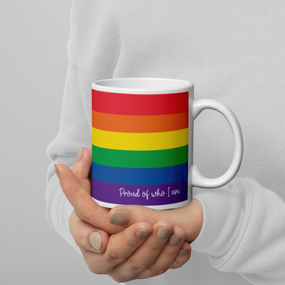 progress pride coffee mug on hands