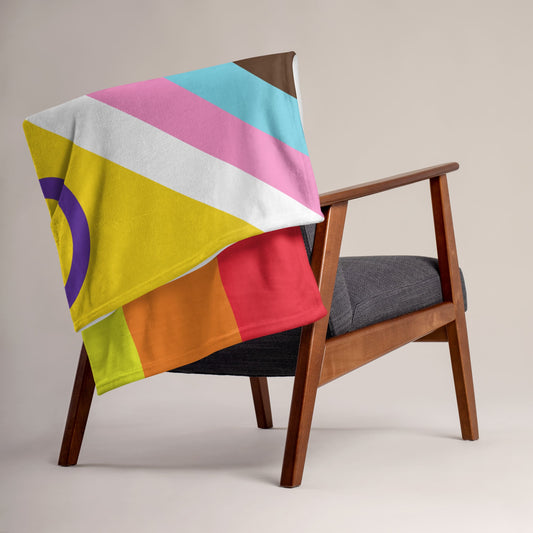 progress pride blanket on chair