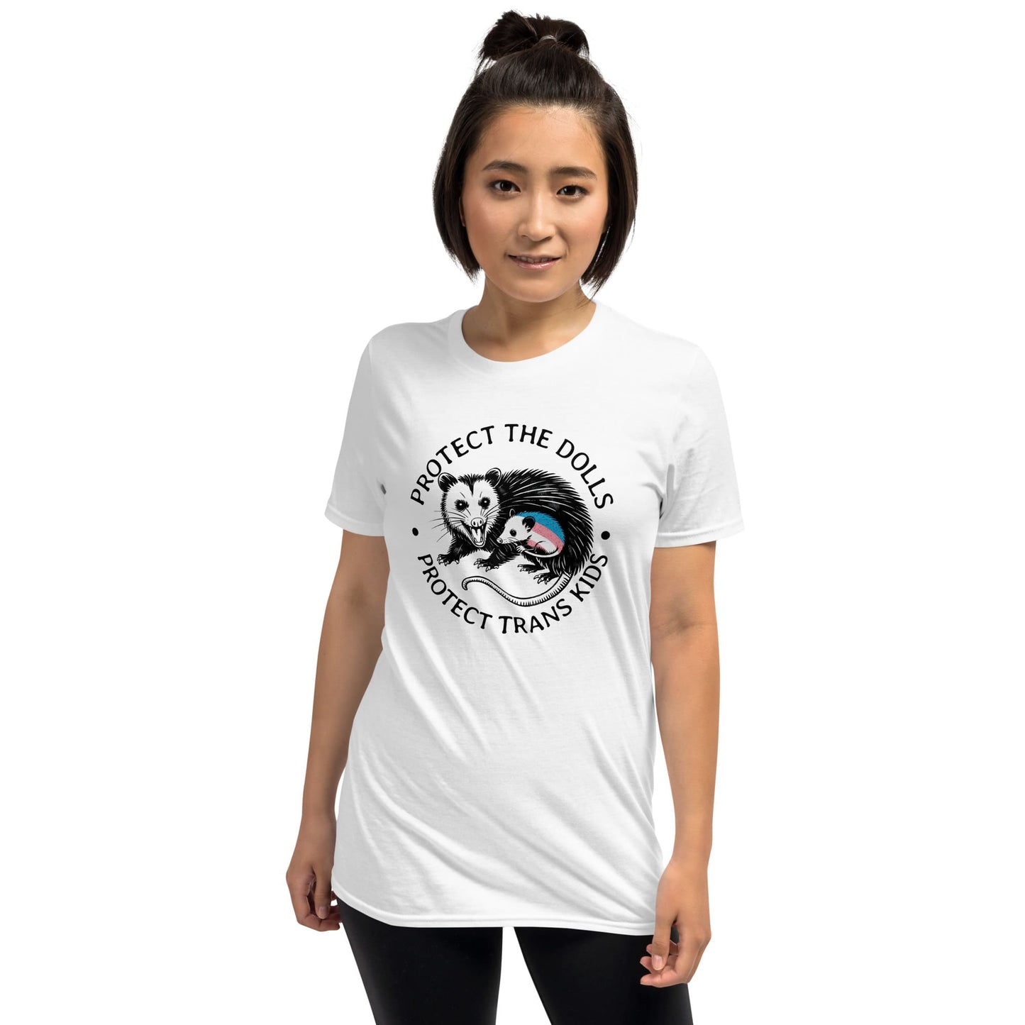 Person wearing a white t-shirt with a graphic design and text on a white background: Protect The Dolls Shirt, Protect Trans Kids Tee, Transgender Pride T-Shirt, Unhinged Opossum Fighting Trans Rights Shirt, MTF Femme Mom Gift