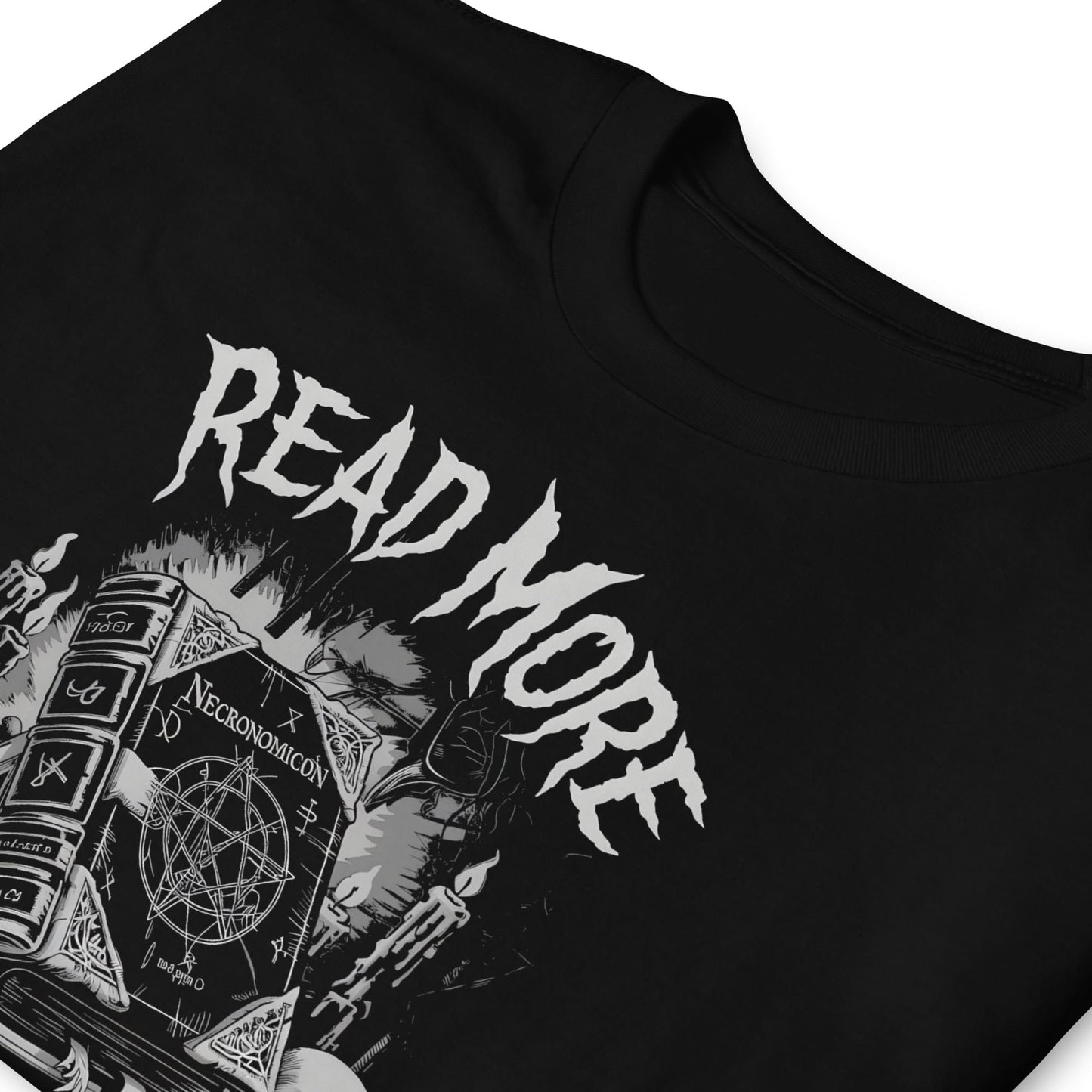 Black t-shirt with 'Read More Banned Books' Necronomicon text and book design on a white background