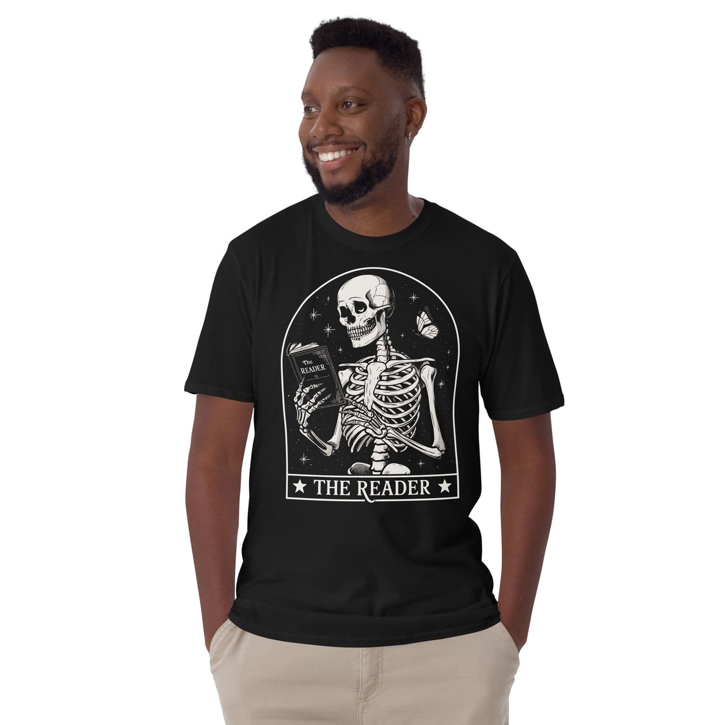 Man wearing a black t-shirt with a skeleton design and 'The Reader' text on a white background