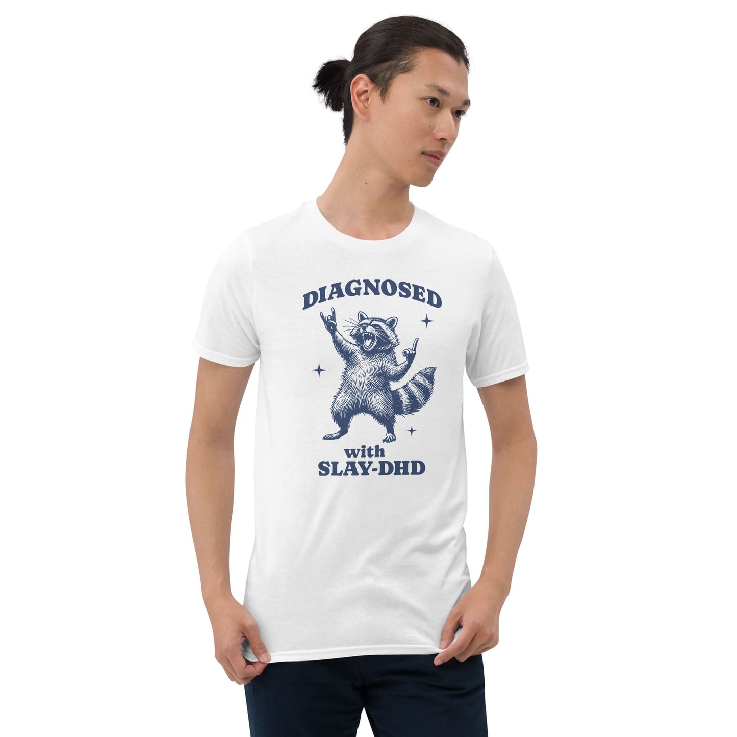 Person wearing a white t-shirt with a graphic and text on a white background: Funny ADHD Shirt, Unhinged Raccoon Tee, Dumb Y2K meme Neurodivergent T-Shirt, Neurospicy Gift For AuDHD, Mental Health Awareness