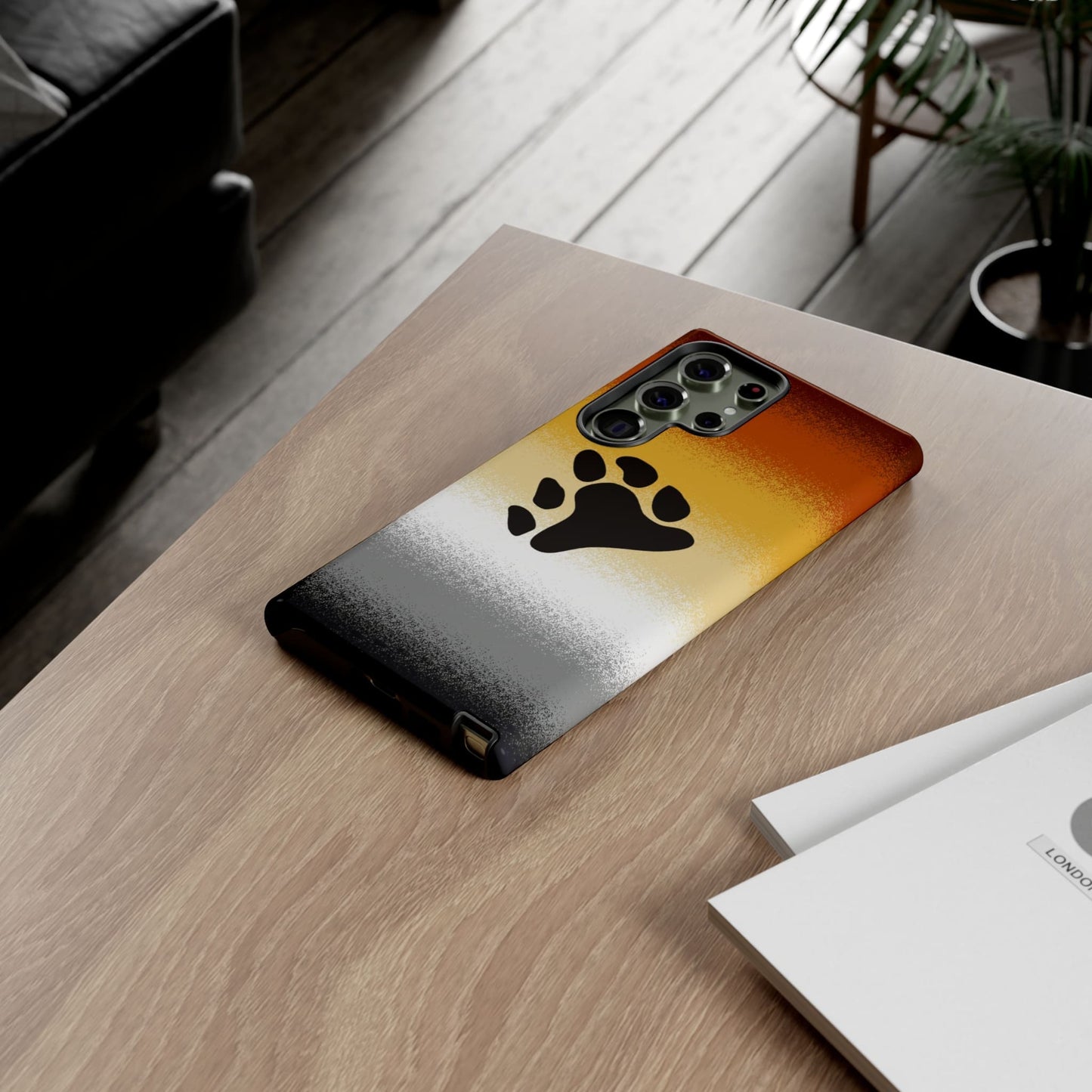 Bear pride phone case sprayed flag, on table