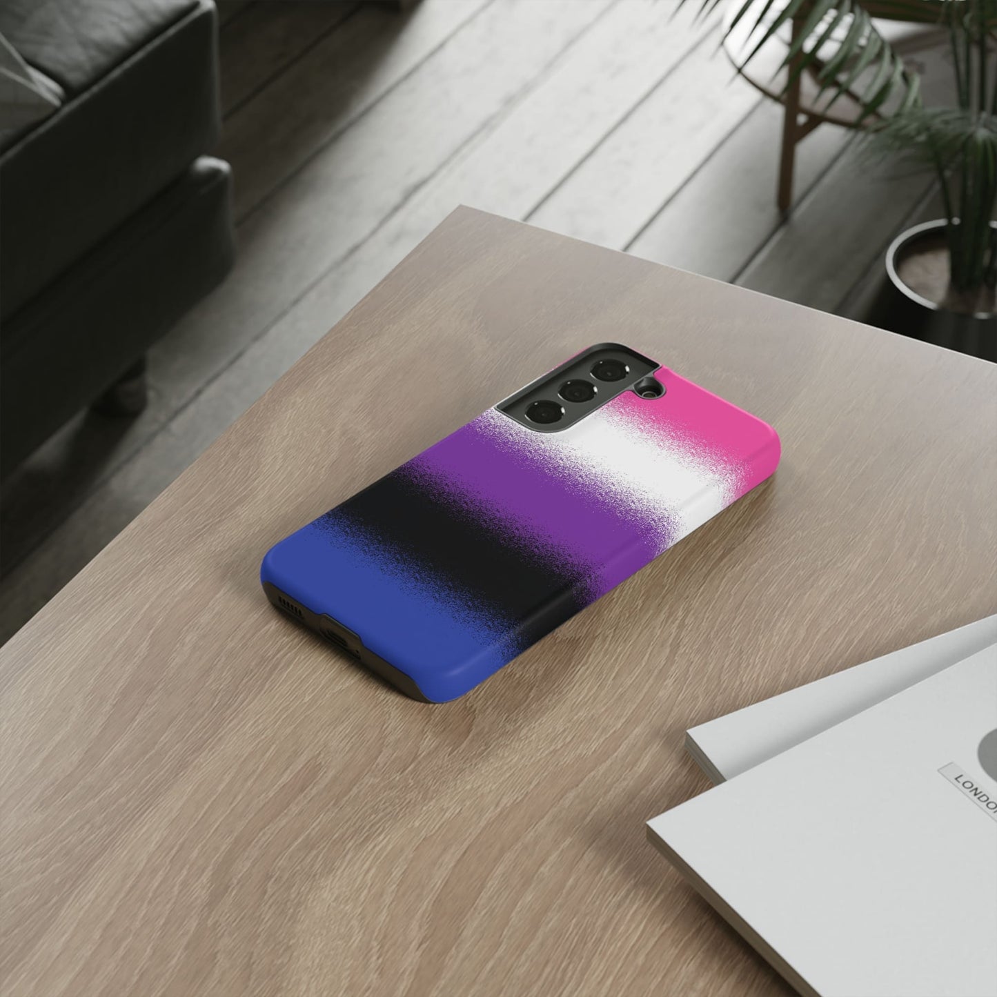 Genderfluid phone case sprayed flag, on table