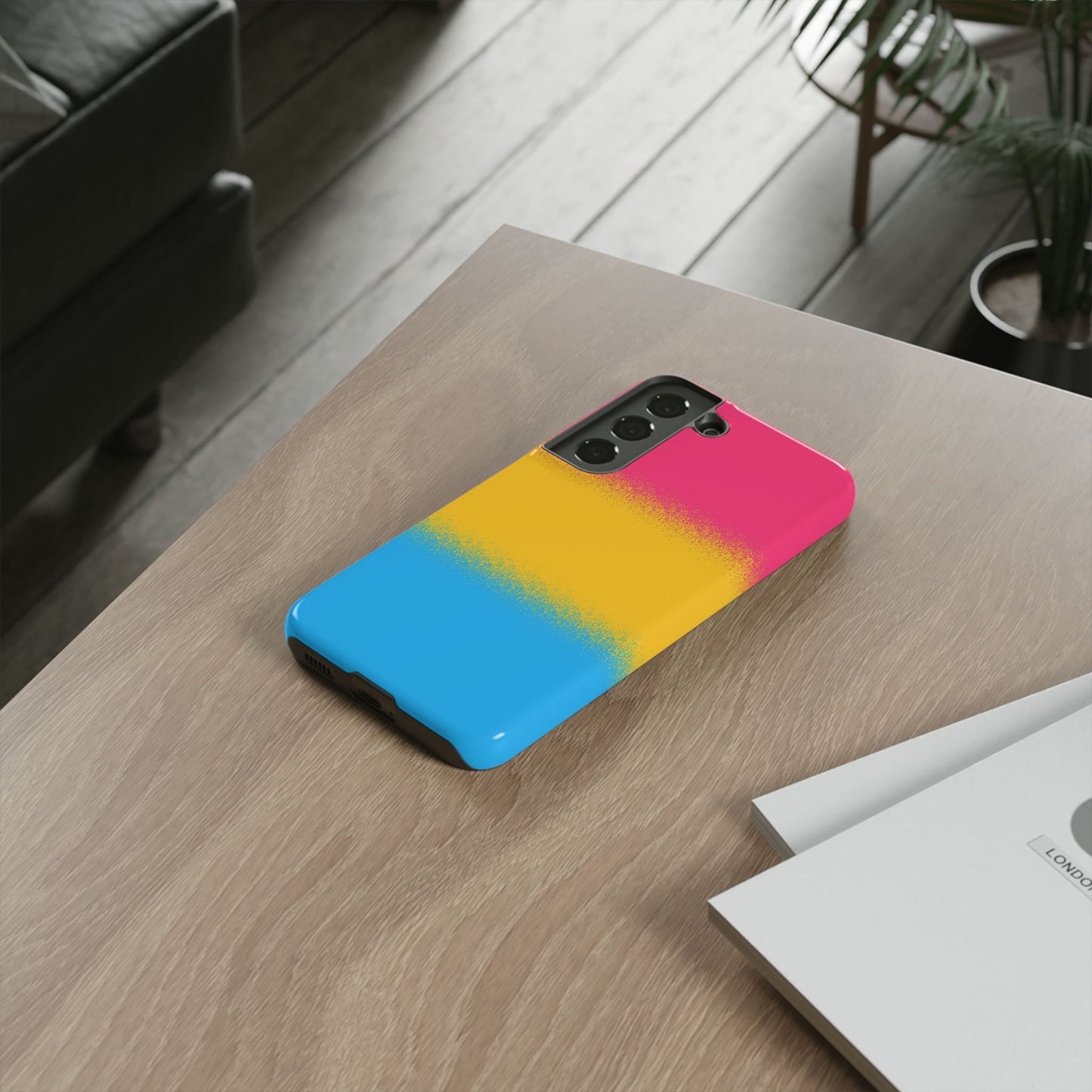 Pansexual phone case sprayed flag, on table