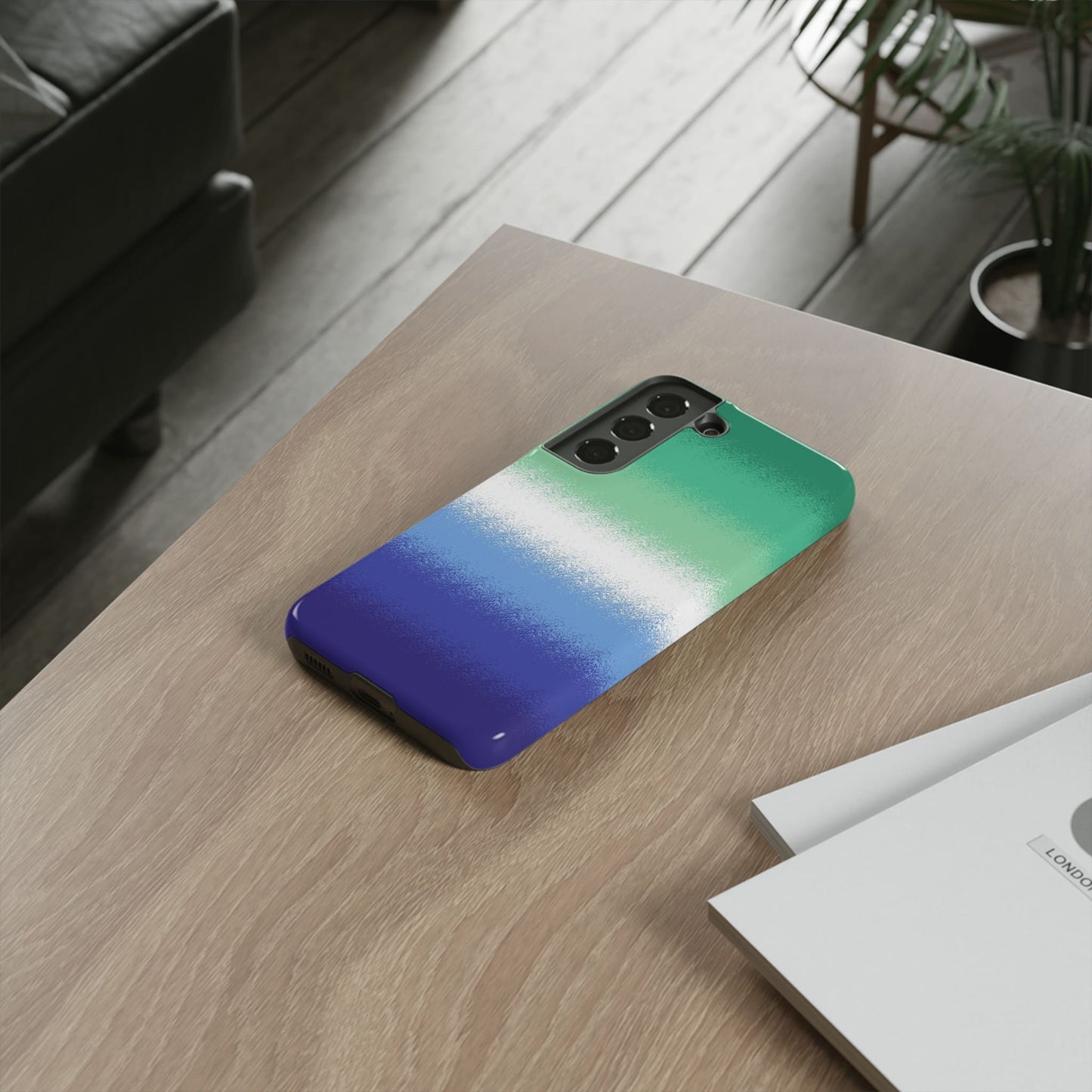 Gay MLM phone case sprayed vincian flag, on table