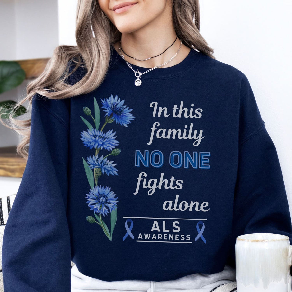 woman wearing navy ALS awareness sweatshirt