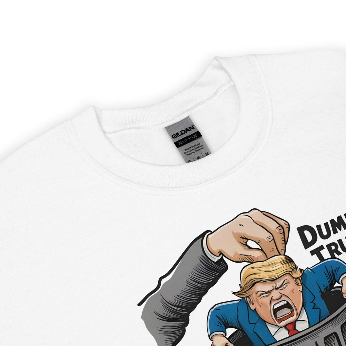 White t-shirt with a graphic design of a hand dumping Trump, with 'Gildan' label visible.