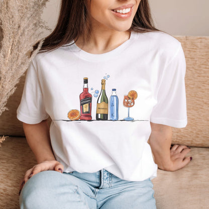 Person wearing a white t-shirt with a graphic design of bottles and a cocktail.