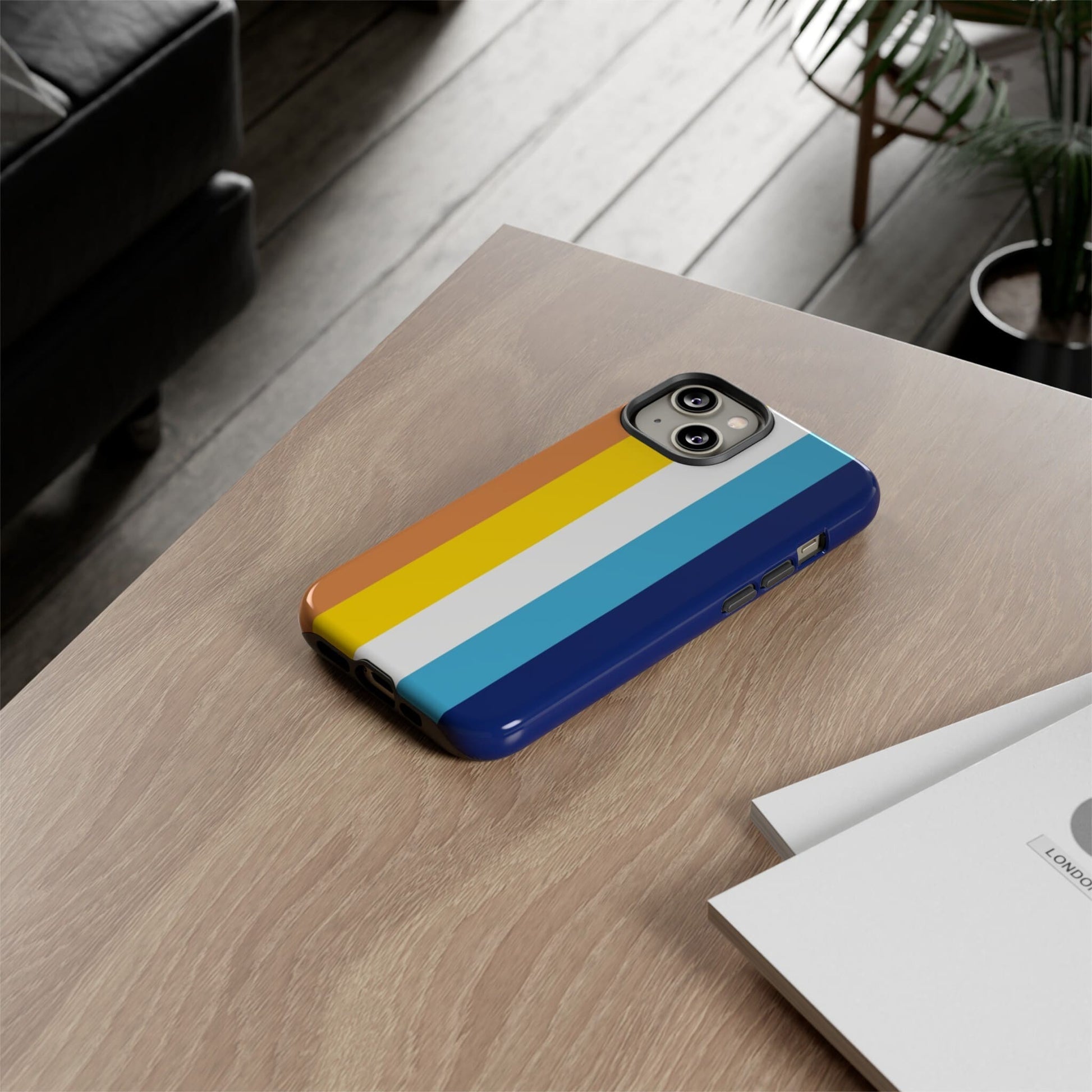 aroace flag phone case, on table