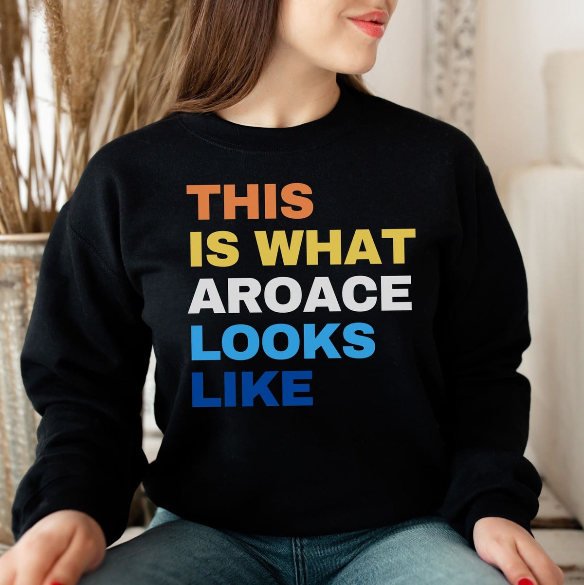 woman wearing aroace sweatshirt in black
