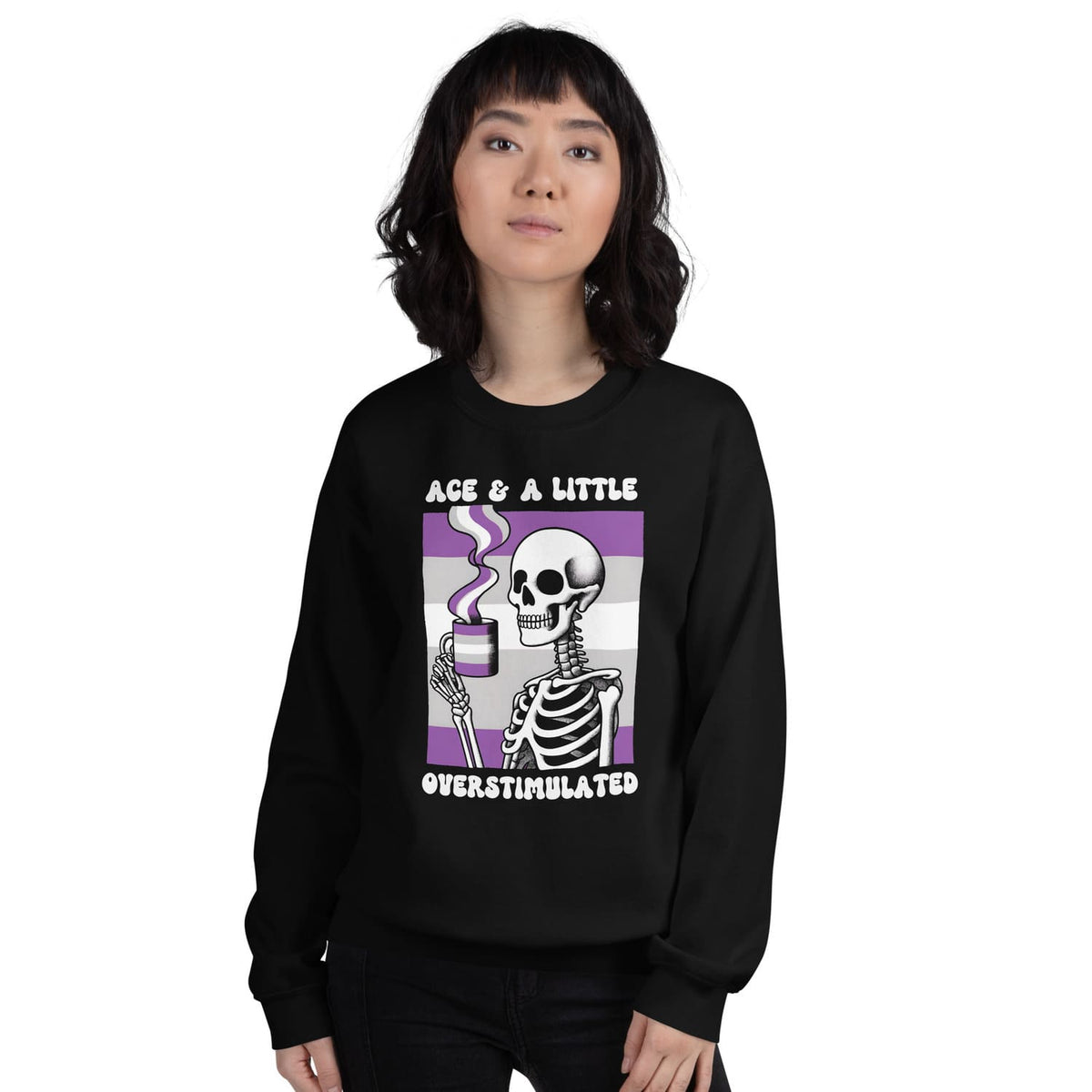 Person wearing a black asexual anxiety sweatshirt with a skeleton design and text on a white background