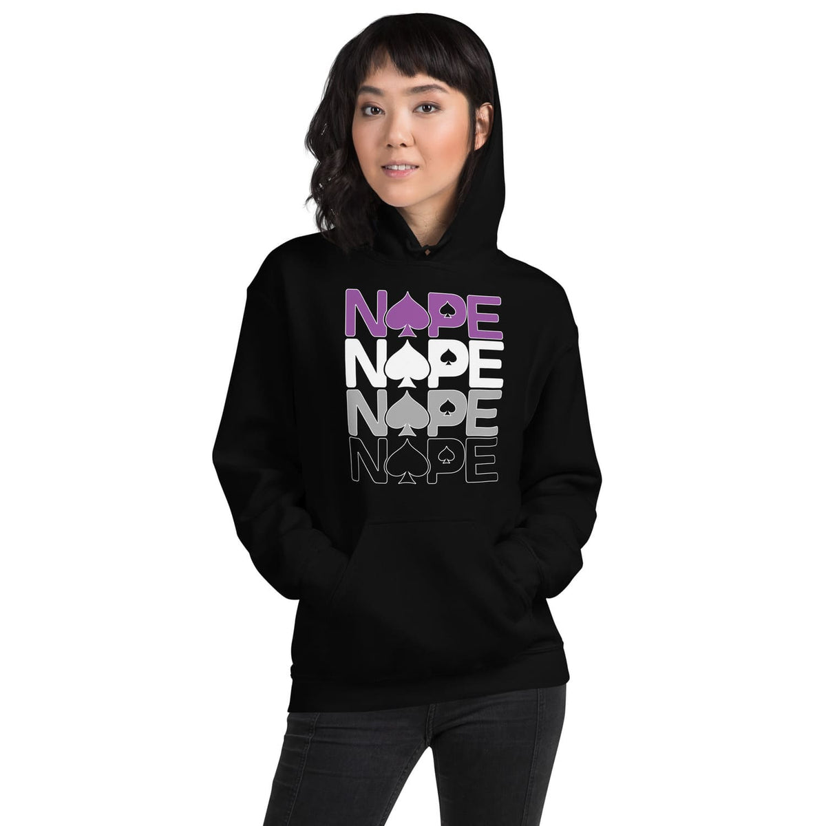 Person wearing a black asexual ace of spades hoodie with text on a white background