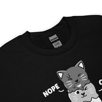 detail of asexual sweatshirt with cartoon cats , brand label visible