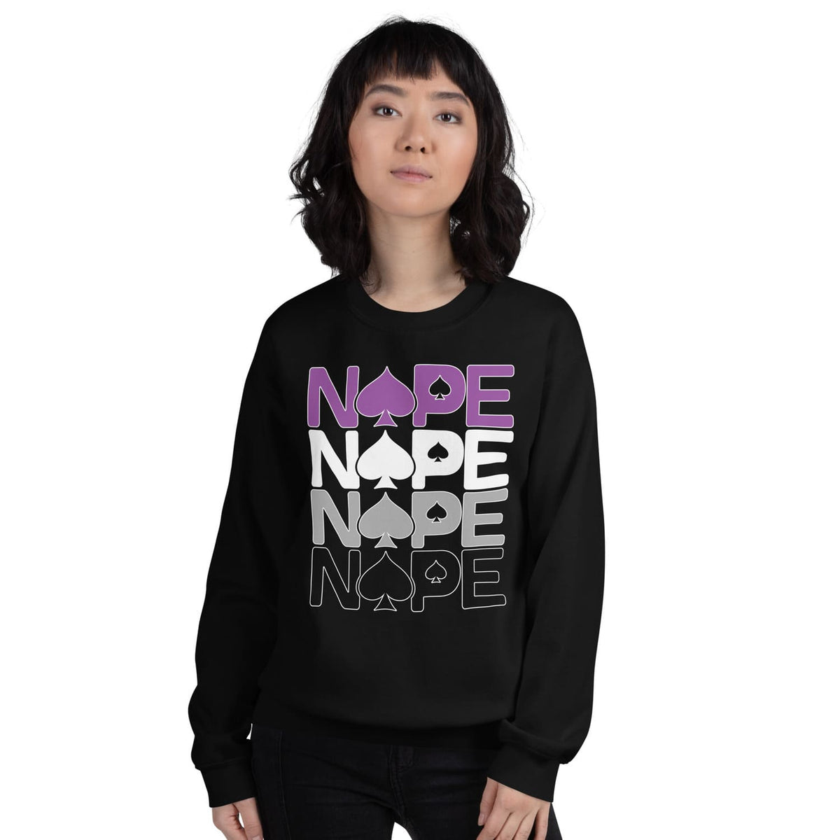 Person wearing a black asexual sweatshirt with 'NOPE' printed in purple and gray.