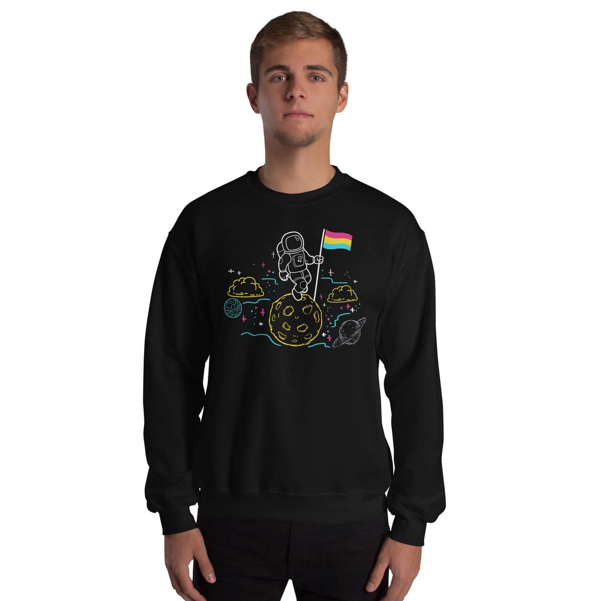 Person wearing a black pansexual sweatshirt with an astronaut and pride flag design on a white background