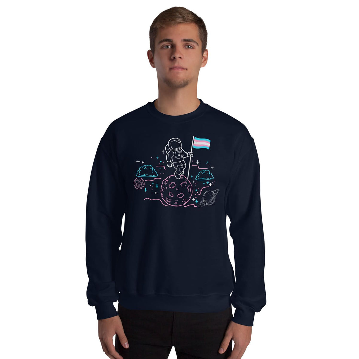 Person wearing a navy blue sweatshirt with an astronaut trans pride design on a white background