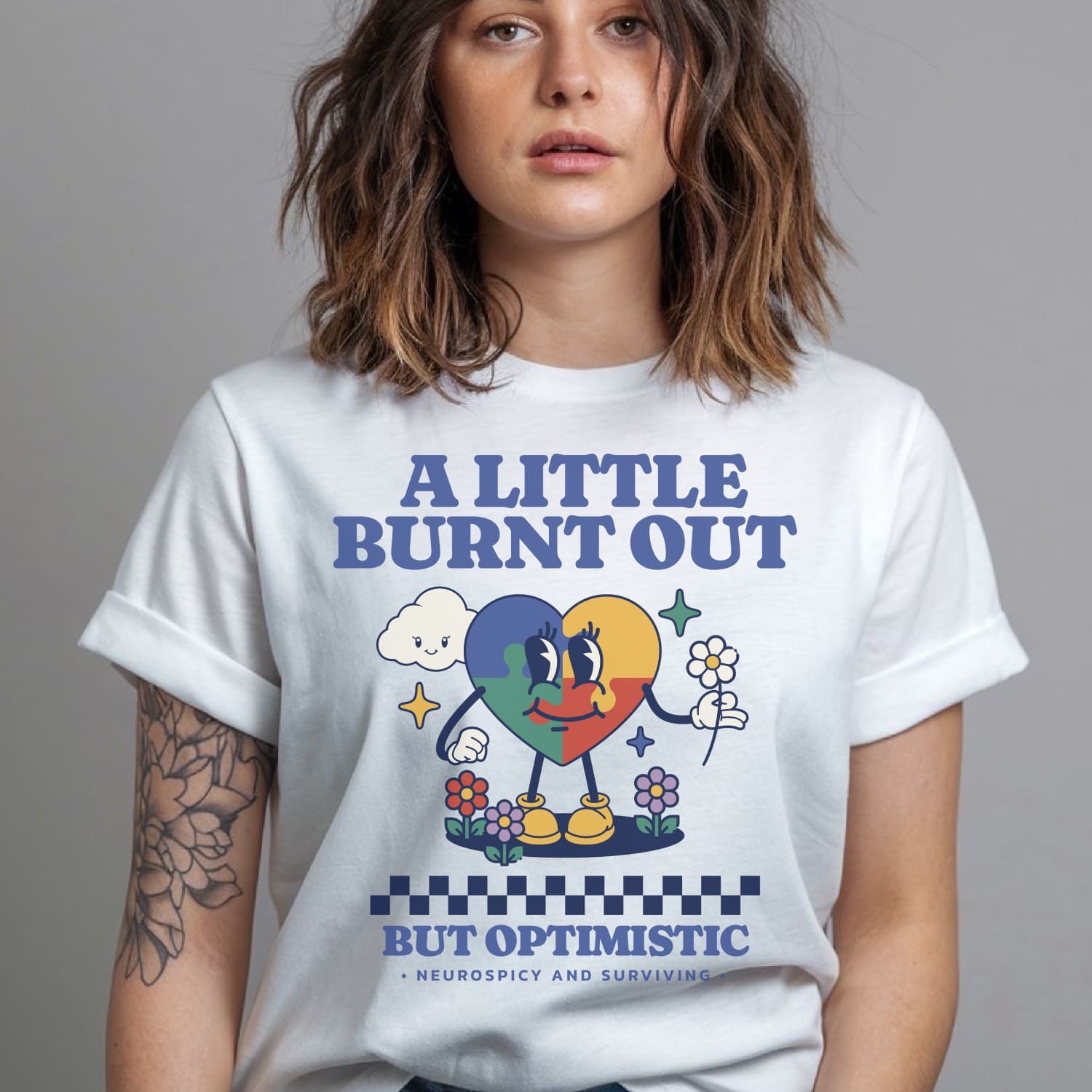 Person wearing a white t-shirt with colorful graphic and text: Retro Autism Shirt, Neurodivergent Affirming Tee, ADHD AuDHD Burnout TShirt, Motivational Shirt For Neurospicy, Positivity Gift For Autistic