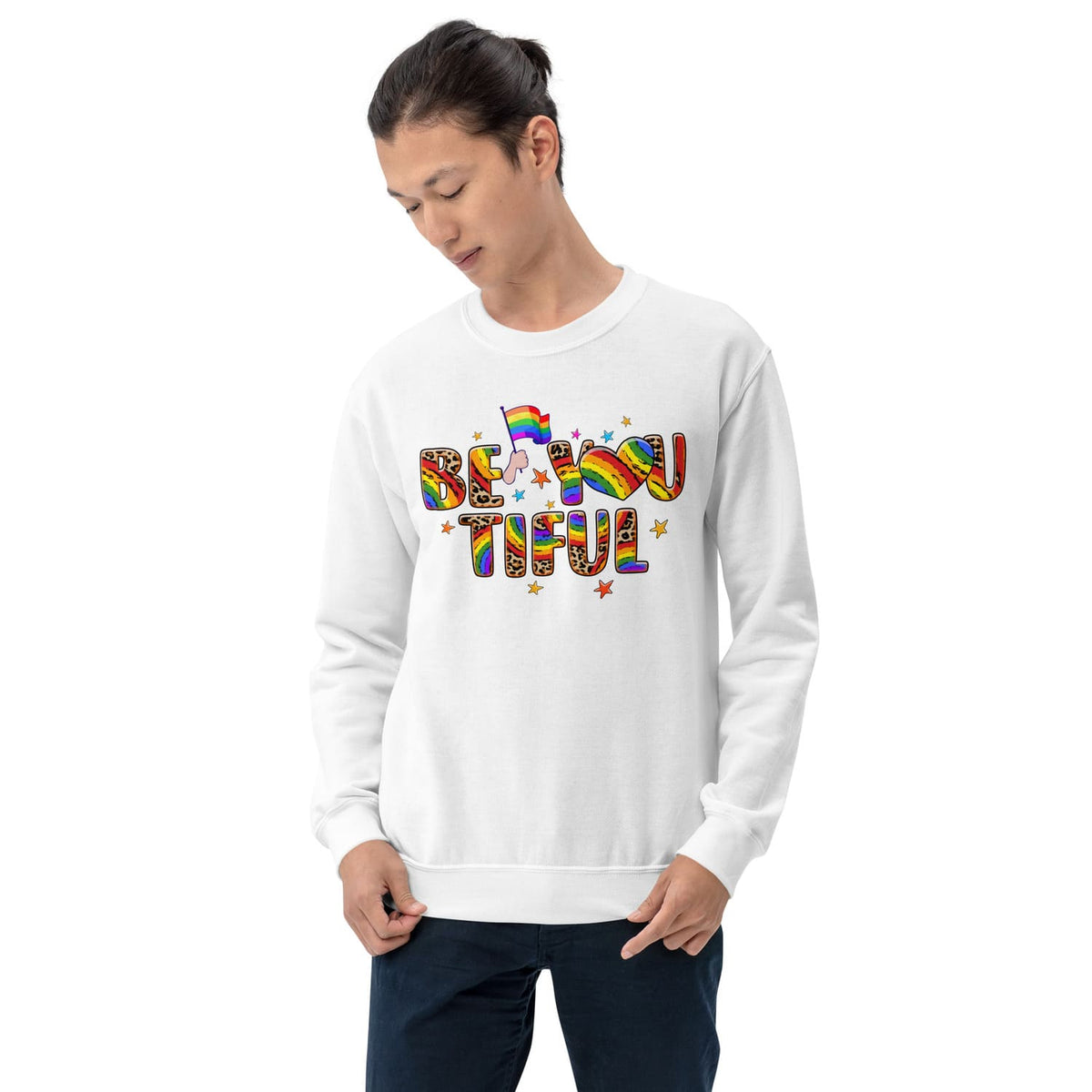 Person wearing a white sweatshirt with rainbow text and lgbtq elements on a white background