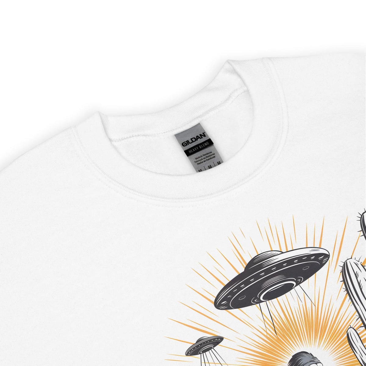 White bigfoot sweatshirt with a UFO graphic and 'Gildan' label on a white background