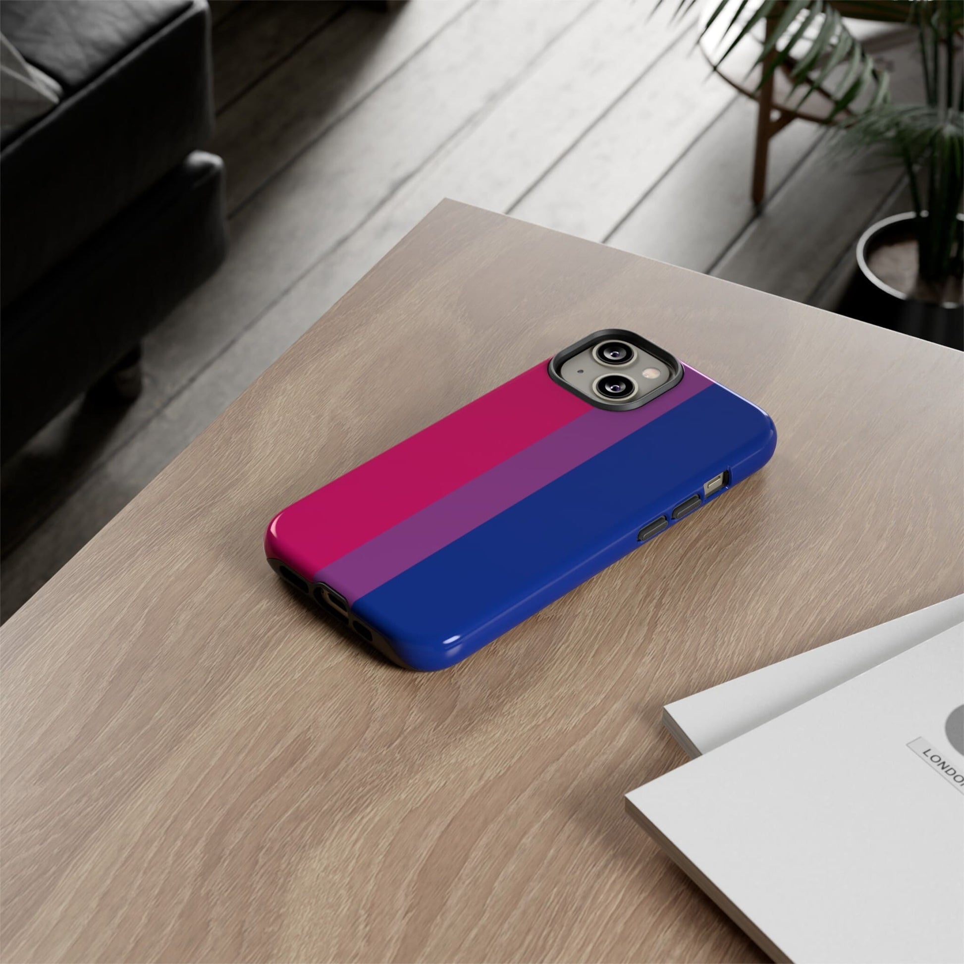 bisexual flag phone case, on table