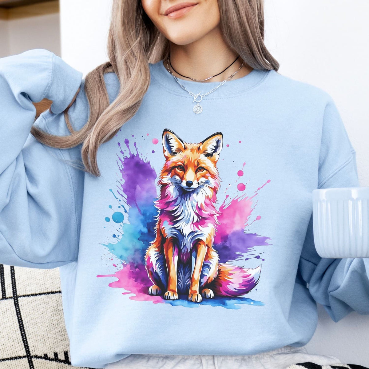 woman wearing blue bisexual sweatshirt with bi pride fox