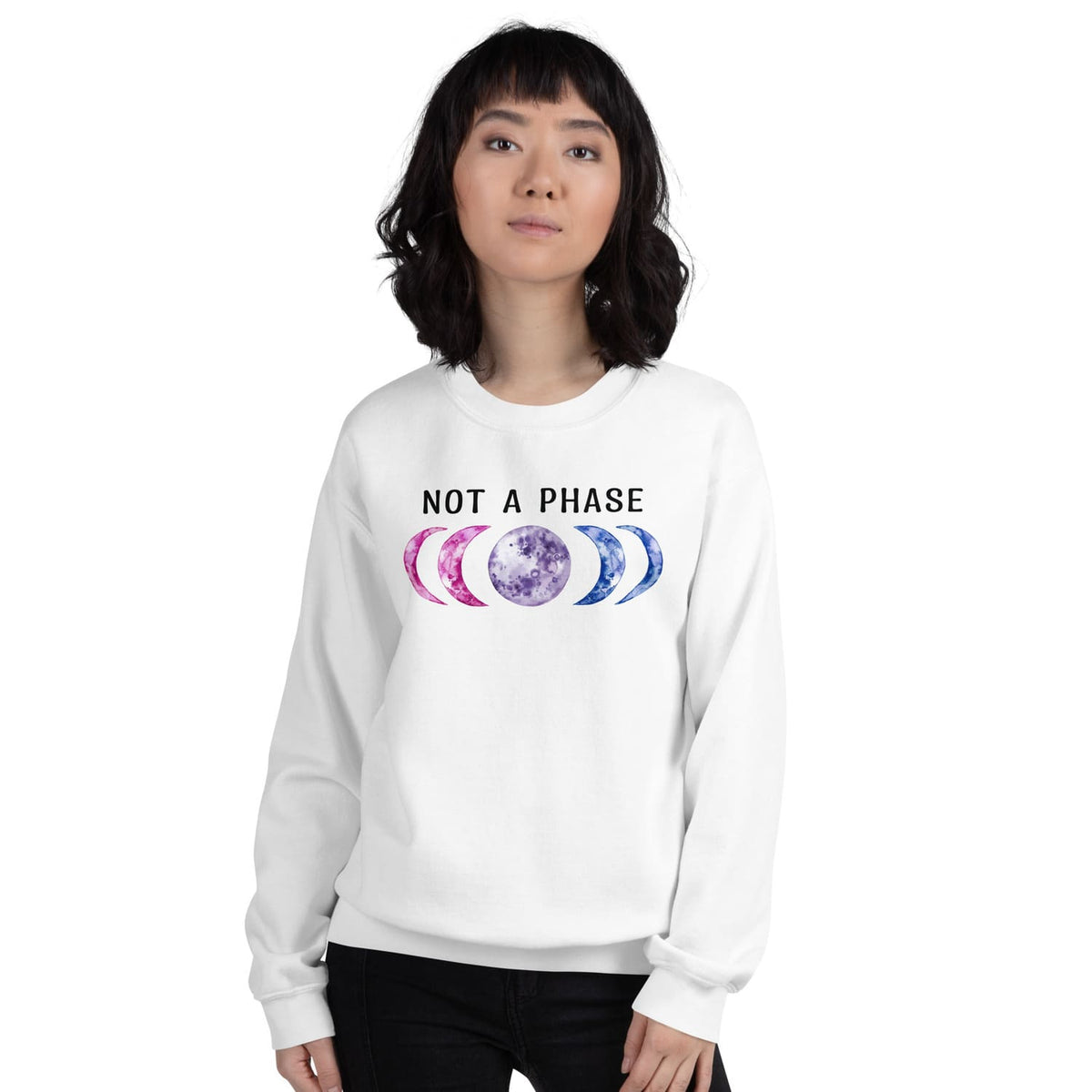 Person wearing a white bisexual sweatshirt with moon phase design and 'Not a Phase' text on a white background