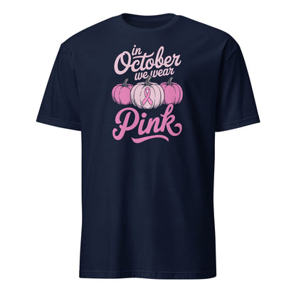 Navy blue breast cancer awareness t-shirt with pink ribbon and pumpkins with pink and white graphics and text on a white background