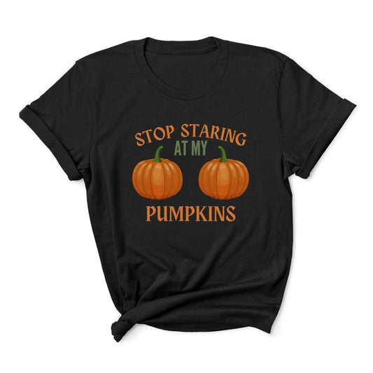Black halloween t-shirt with orange pumpkins and text 'Stop Staring at My Pumpkins' on a white background